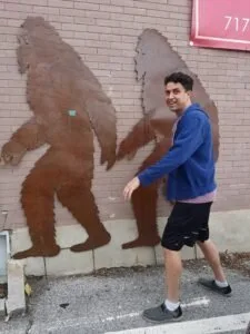 justin standing next to bigfoot